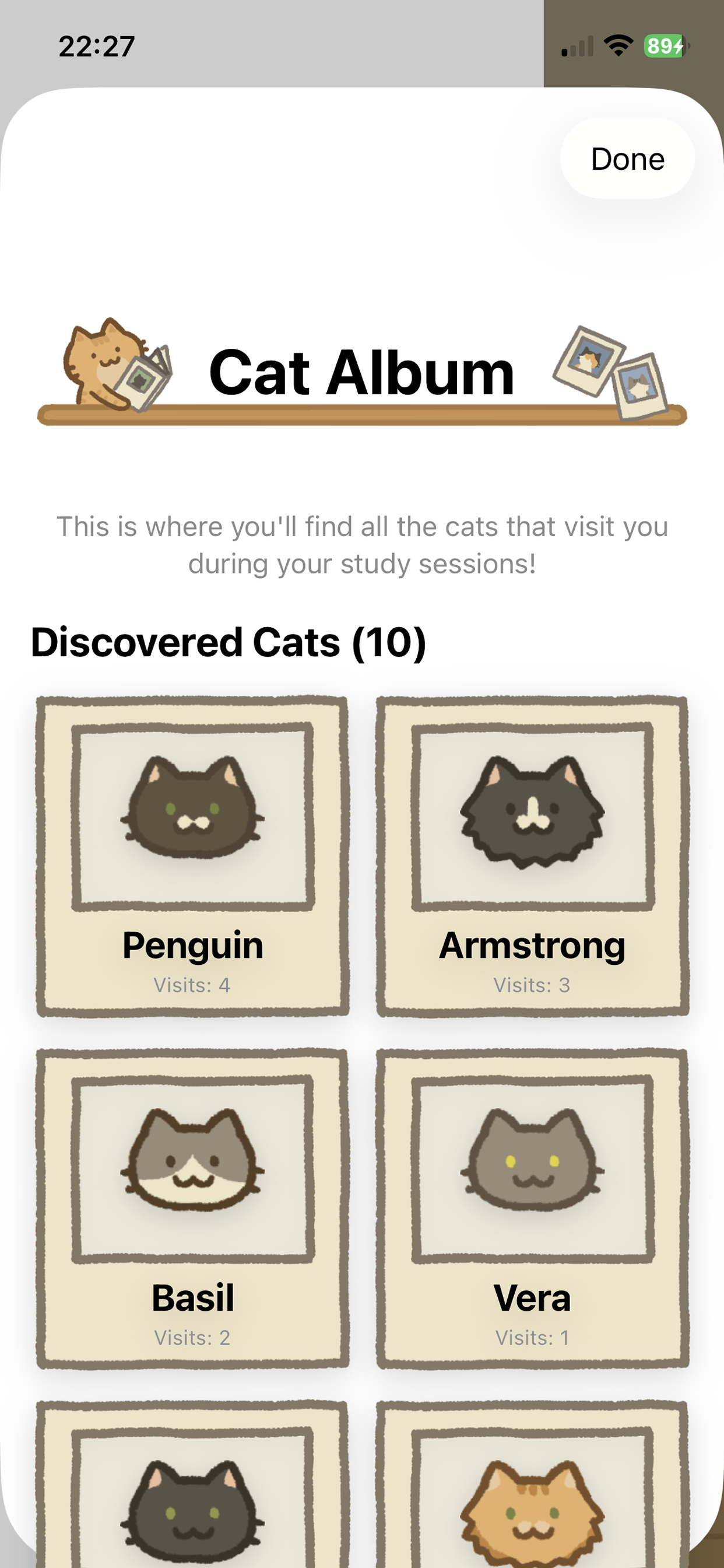 Cat Album screen showing discovered cats with visit counts