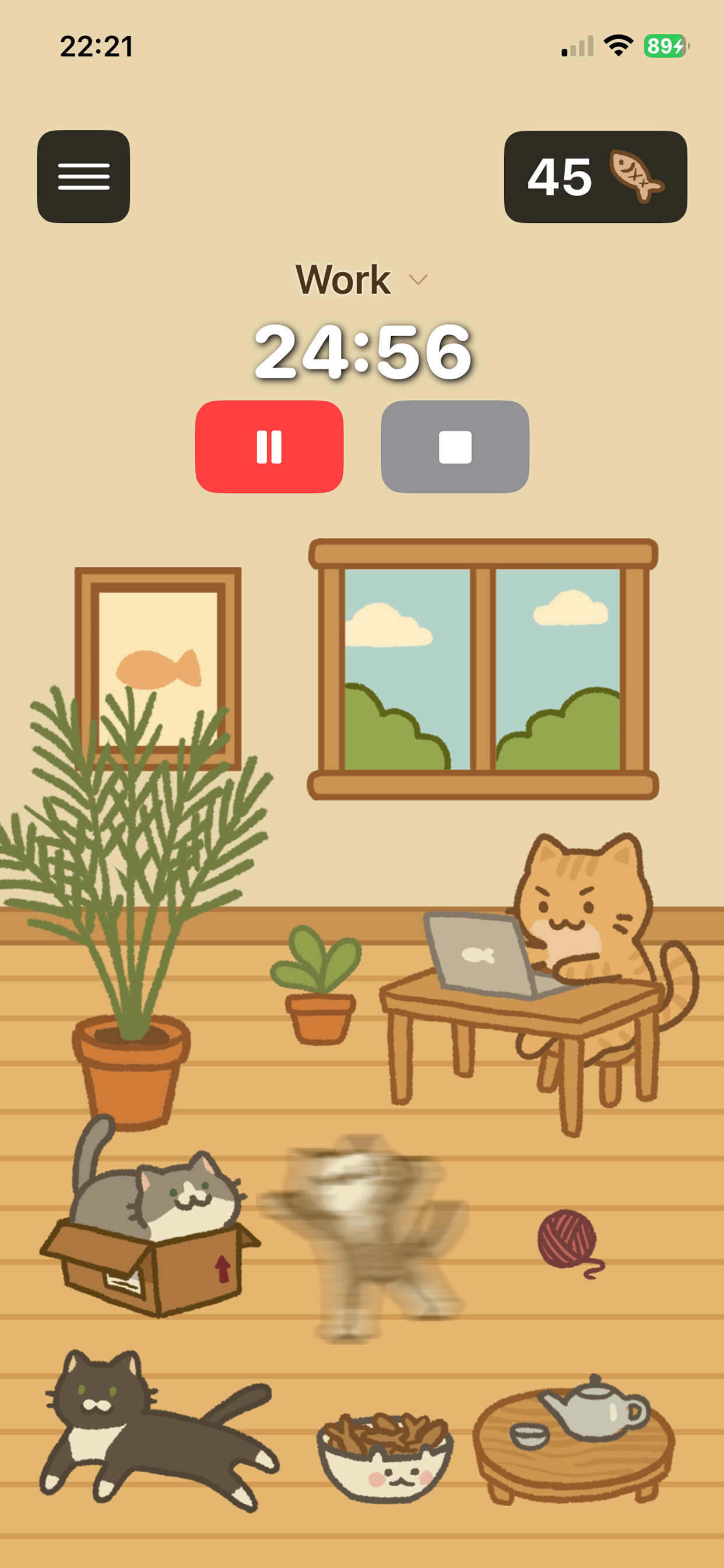 Main screen with the orange cat at a laptop, a focus timer, and a cosy room full of cats and decorations